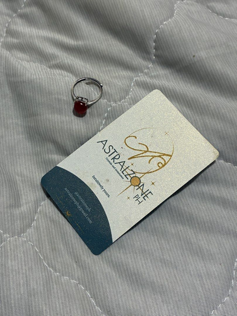 Astralzone Adjustable Ring with Carnelian Stone (Category: Rings) located in Cainta. Submitted by thingsfromerika (Listing ID 1464500661, Image 2). Description: - Adjustable ring with a beautiful orange-red stone. - Cushion-cut stone set in silver-toned metal. - Brand: Astralzone PH. - Comes with a crystal message card. - Perfect for adding a pop of color to your outfit. - silver .