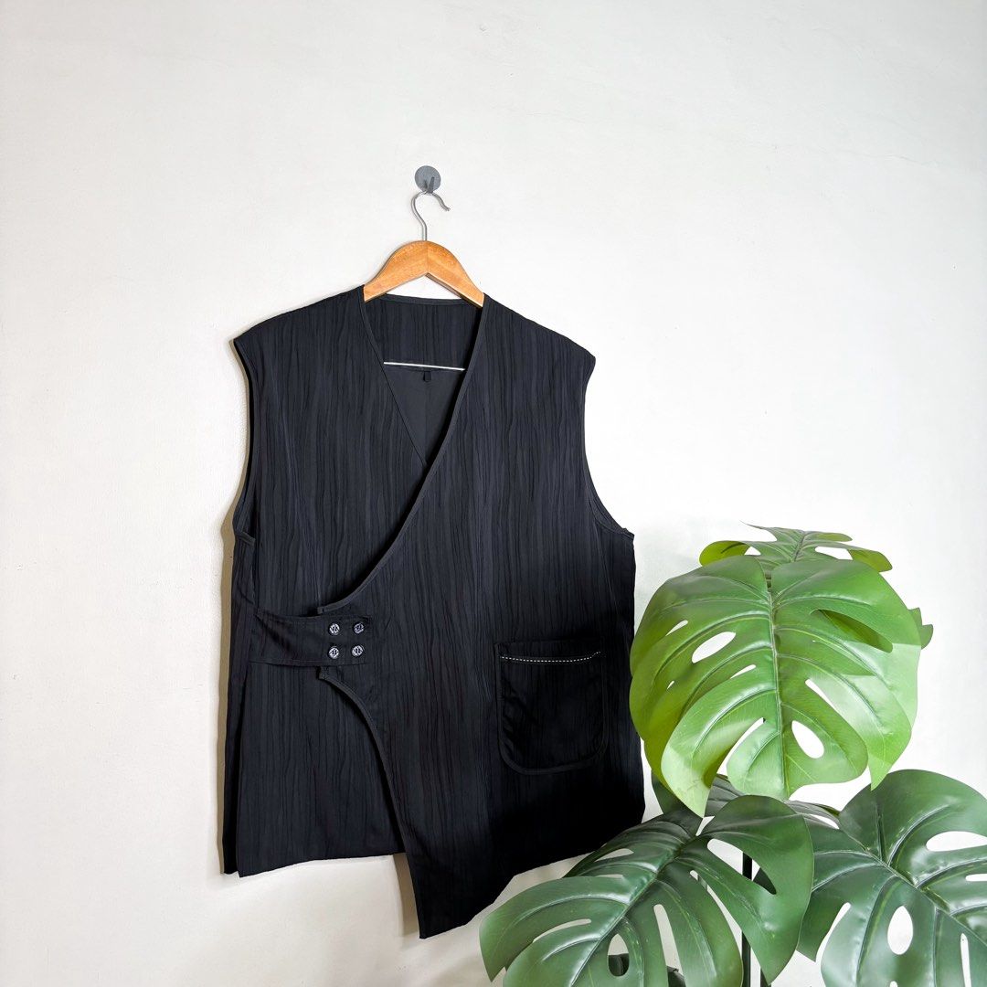 Asymmetrical | Wrap Vest. (Category: Vests) located in Manila. Submitted by bypiecesandstories (Listing ID 1464481009, Image 1). Description: Asymmetrical | Wrap Vest. 699 PHP 🧡 Perfect Condition Can Fit — Small to Large Dimensions — W 23" L 27.5" A sleek black vest with an asymmetrical silhouette that gives off a sophisticated, designer inspired feel. A standout layering piece that easily elevates even the simplest everyday look. • REMINDERS • 