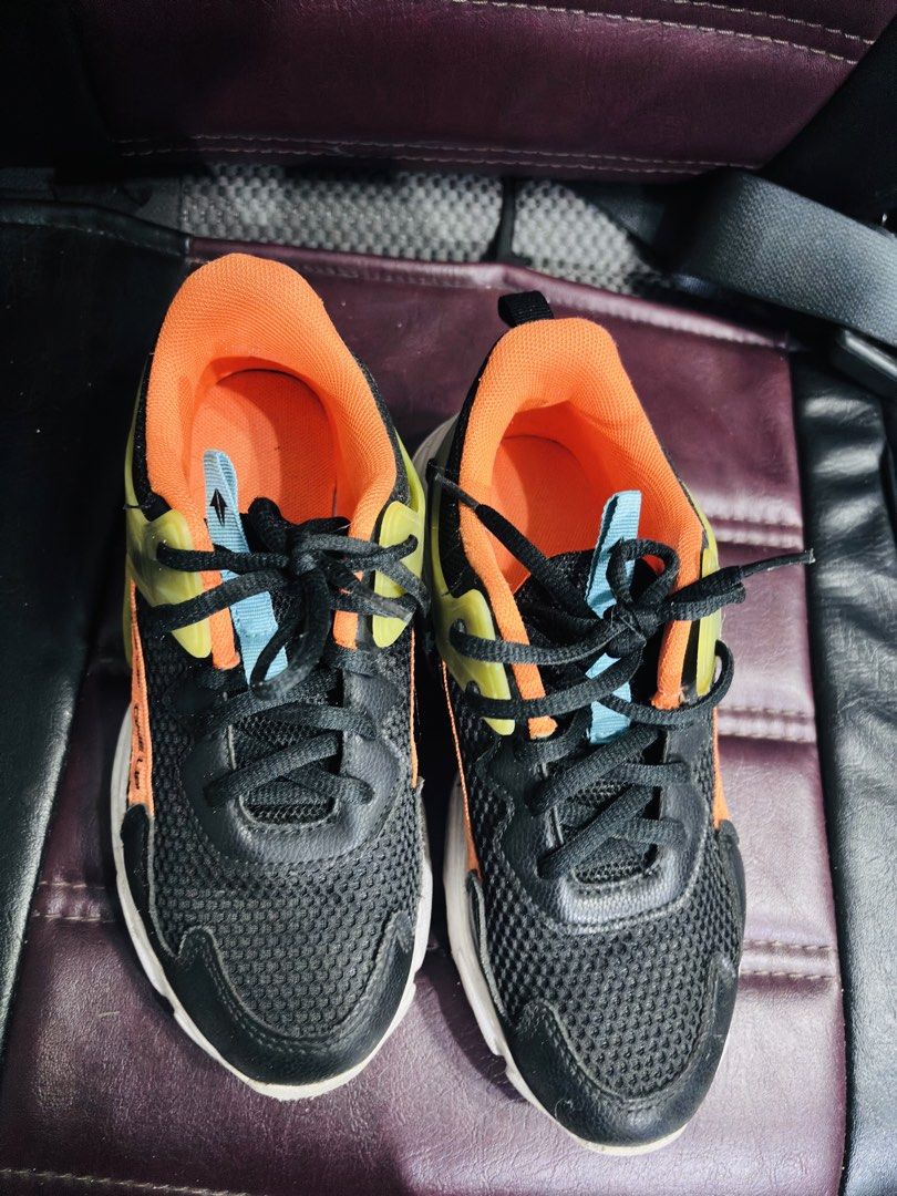 Athleisure Myriad BB Athletic Shoes (Category: Casual Shoes) located in Manila. Submitted by purpleliciousss (Listing ID 1464383556, Image 2). Description: - Stylish black and orange athletic shoes - Size: EUR 35 / US 2 - Features a breathable mesh upper with synthetic overlays - Comfortable for everyday wear and light workouts - Ideal for achieving a casual and sporty look.