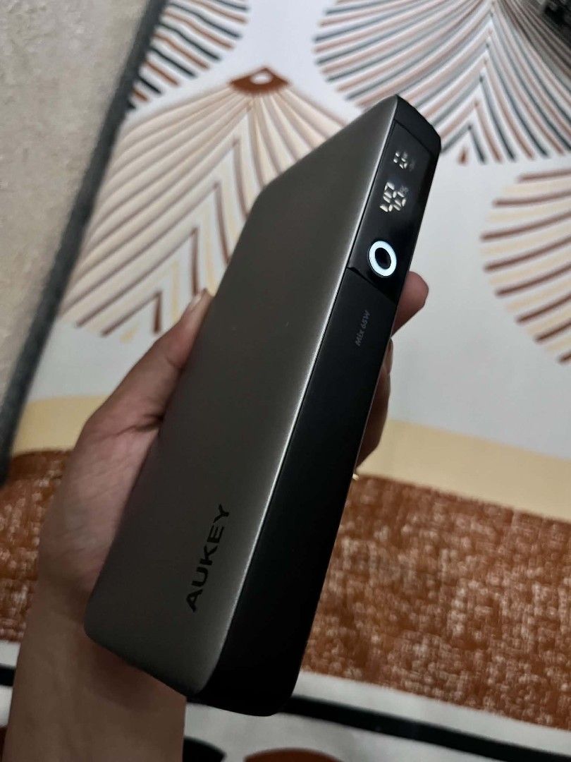 Aukey Power Bank 20,000 (Category: Other Gadgets) located in Quezon City. Submitted by iamghen21 (Listing ID 1464521869, Image 1). Description: Aukey PB-Y43 Sprint X 20K 65W 20000mAh Portable Power Bank with PD3.0 Technical SpecificationsModel: PB-Y43 (Sprint X Series)Battery Capacity: 20,000mAh / 74WhBattery Type: Lithium-PolymerTotal Ports: 3 (2 × USB-C + 1 × USB-A)Dimensions: 156 × 73 × 25 mmWeight: 390 grams Key FeaturesSmart Digital Display: