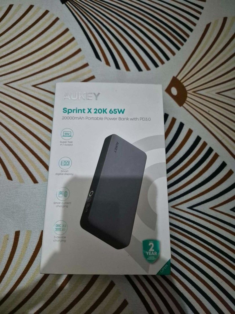 Aukey Power Bank 20,000 (Category: Other Gadgets) located in Quezon City. Submitted by iamghen21 (Listing ID 1464521869, Image 2). Description: Aukey PB-Y43 Sprint X 20K 65W 20000mAh Portable Power Bank with PD3.0 Technical SpecificationsModel: PB-Y43 (Sprint X Series)Battery Capacity: 20,000mAh / 74WhBattery Type: Lithium-PolymerTotal Ports: 3 (2 × USB-C + 1 × USB-A)Dimensions: 156 × 73 × 25 mmWeight: 390 grams Key FeaturesSmart Digital Display: