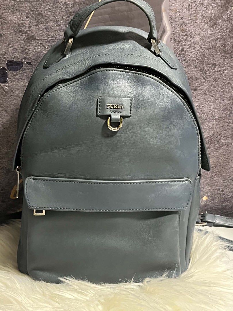 Aunthentic Furla back pack (Category: Luxury Bags & Wallets) located in Caloocan City. Submitted by trebdy01 (Listing ID 1464475712, Image 1). Description: Preloved furls backpack From italy Issue some tear s bandang zipper nasa photospero di sya halata .