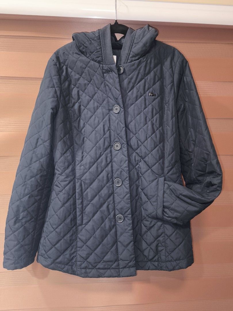 Auth Lacoste Dark Blue Quilted Hooded Jacket (Category: Coats, Jackets and Outerwear) located in Baguio. Submitted by zia_zab (Listing ID 1464489760, Image 2). Description: - Lacoste Dark blue quilted jacket - Hooded design -Lightweight - Button-up front - Convenient pockets - Ribbed cuffs for extra warmth - Medium Womens, Small Mens -19in x 28in - Ideal for cooler weather.