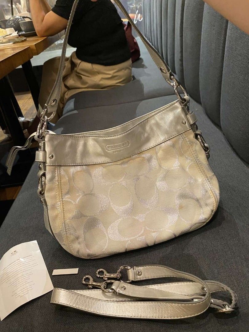 Authentic coach (Category: Luxury Bags & Wallets) located in Cebu City. Submitted by bisayaseller77 (Listing ID 1464525865, Image 1). Description: coach zoe ivory/silver metallic hobo bag Bag has minor discoloration outside.Interior part is excellent condition. With 2 straps selling at 2,800.