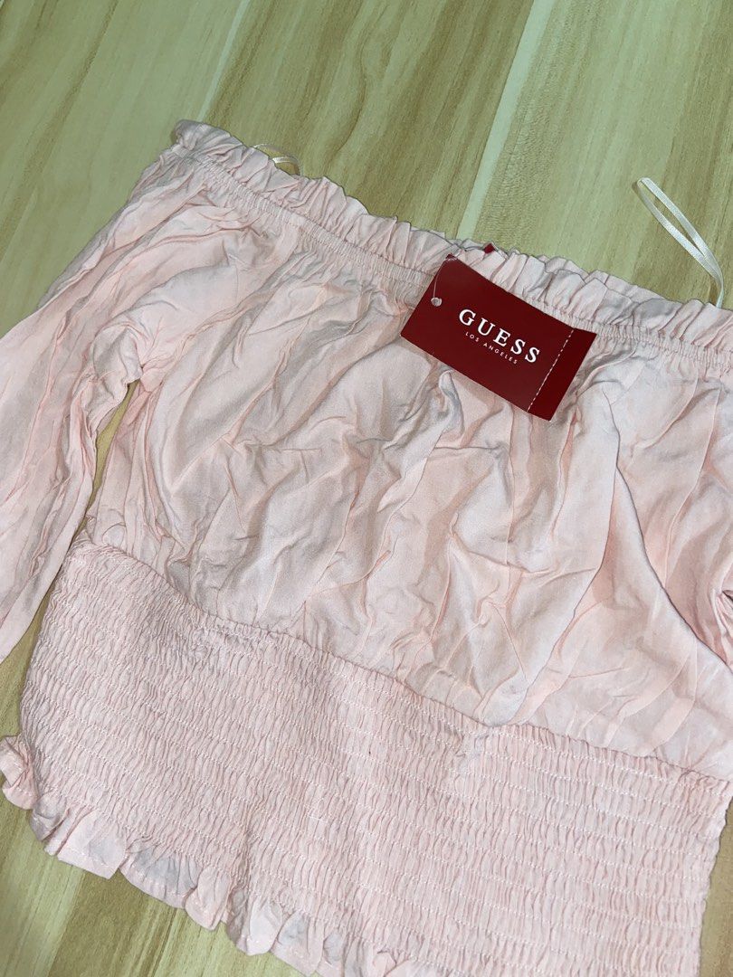 GUESS Authentic Camila Off- Shoulder Top (Category: Longsleeves) located in Guinobatan. Submitted by jadieee_young22 (Listing ID 1464402482, Image 1). Description: - never used - quality still very nice and brandnew! - 100% authentic! with Guess tag - bought from canada 🇨🇦 - fits XS as seen in the 2nd picture - long sleeves - color: dolly pink-rose - check the last pictures to see the full view top Rfs: cleaning out unused wardrobe items.