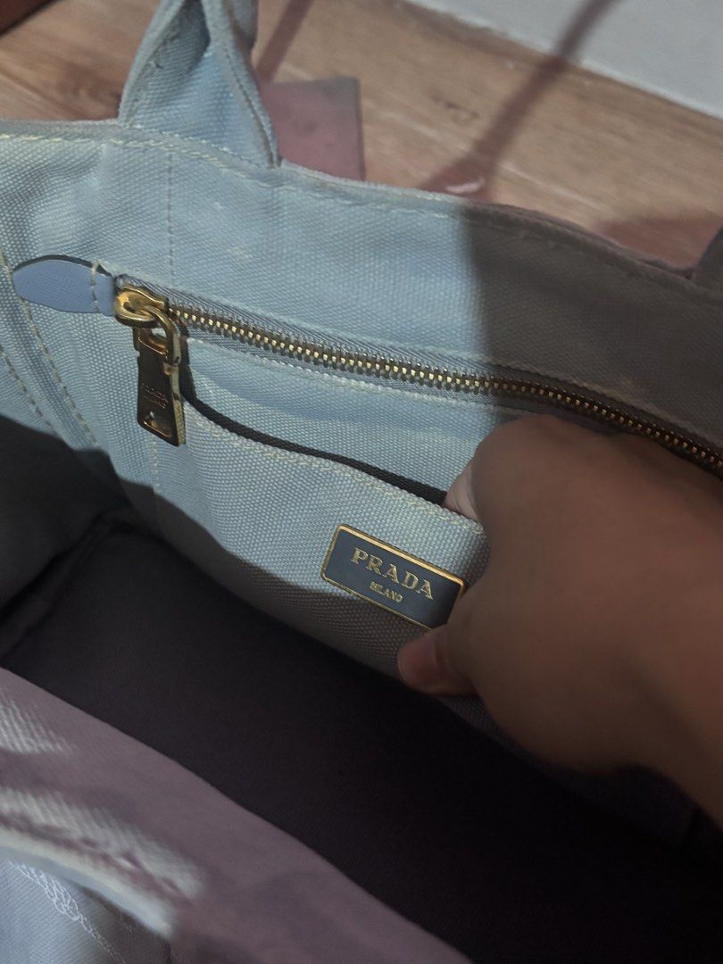 AUTHENTIC Prada Canapa (Category: Luxury Bags & Wallets) located in Baliuag. Submitted by shoppethrift (Listing ID 1464483848, Image 2). Description: -Guaranteed authentic - white tag coded - lampo zip - small size - paint is faded selling low.