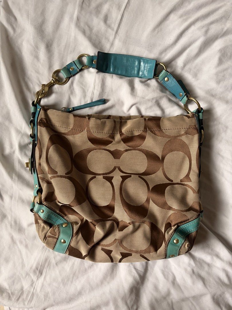 rare vintage y2k coach carly (Category: Luxury Bags & Wallets) located in Manila. Submitted by thriftygirliez (Listing ID 1464413141, Image 3). Description: Interior Flaws: - there are two small holes on the satin lining near the leather creed patch. - staining inside the wall pocket !! both flaws are strictly internal and completely hidden when wearing the bag !! price is negotiable.