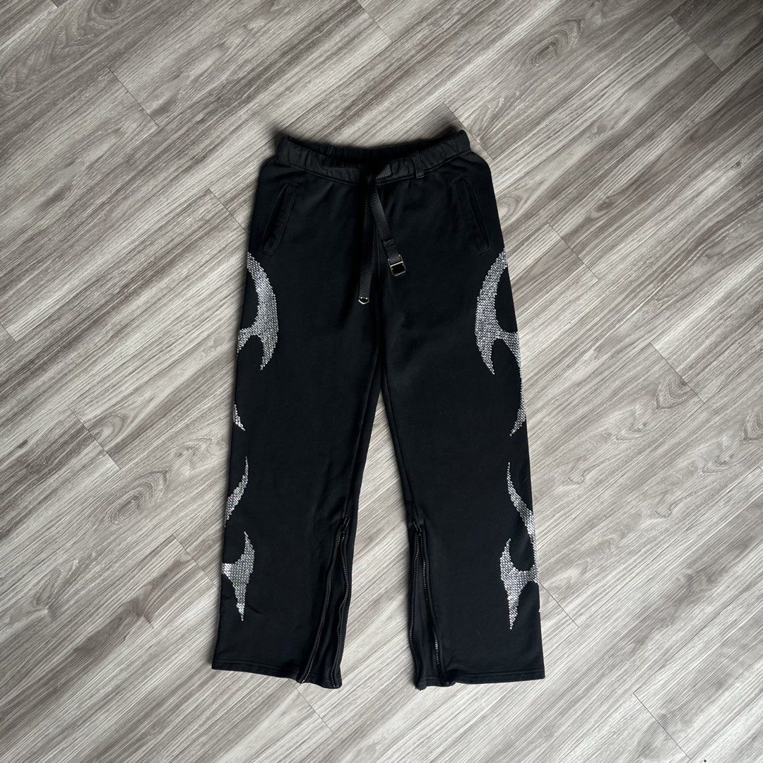 Badblood Rhinestone 2-Way Jogger Pants (Category: Joggers) located in Cebu City. Submitted by specializedgoodsitem_ (Listing ID 1464475157, Image 3). Description: adjustable leg opening excellent to new condition slightly needs wash ( naka display sa store ) details posted color may vary due to light 30 - 34’ waistline 41’ length 10.5’ leg opening ( when zippers open ) 12’ thigh.
