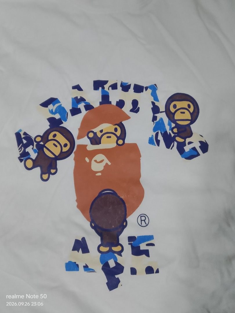 Bape baby Milo shirt (Category: Tshirts & Polo Shirts ) located in San Ildefonso. Submitted by cristopherthrifts (Listing ID 1464467840, Image 2). Description: -Bape baby Milo shirt -Size L on tags W17 L24 -with iconic logo of bape head surrounded by baby Milo -bathing ape camou design -can used for casual wear.