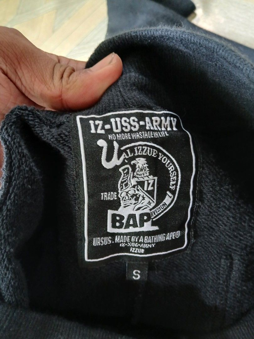 Bape ursus x izzue(authentic) (Category: Joggers) located in San Jose. Submitted by garments17 (Listing ID 1464381041, Image 3). Description: - Brand: IZZY USS ARMY - Color: Black - Size: S - Features: Skull patch on left leg, 'IZ-USS-ARMY' graphic on back pockets, drawstring waist - Origin: Made in China.