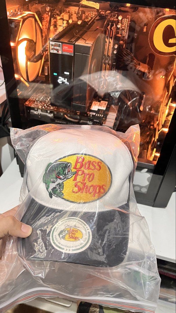 Bass Pro Shops Trucker Hat - Black (Category: Caps & Hats) located in Caloocan City. Submitted by memelpogi21 (Listing ID 1464529887, Image 2). Description: - Two Bass Pro Shops trucker hats included: one red/white, one black/white. - Features the iconic Bass Pro Shops logo with a fish design. - Breathable mesh back for comfort. - One size fits most design. - Ideal for fishing adventures or casual, stylish wear..