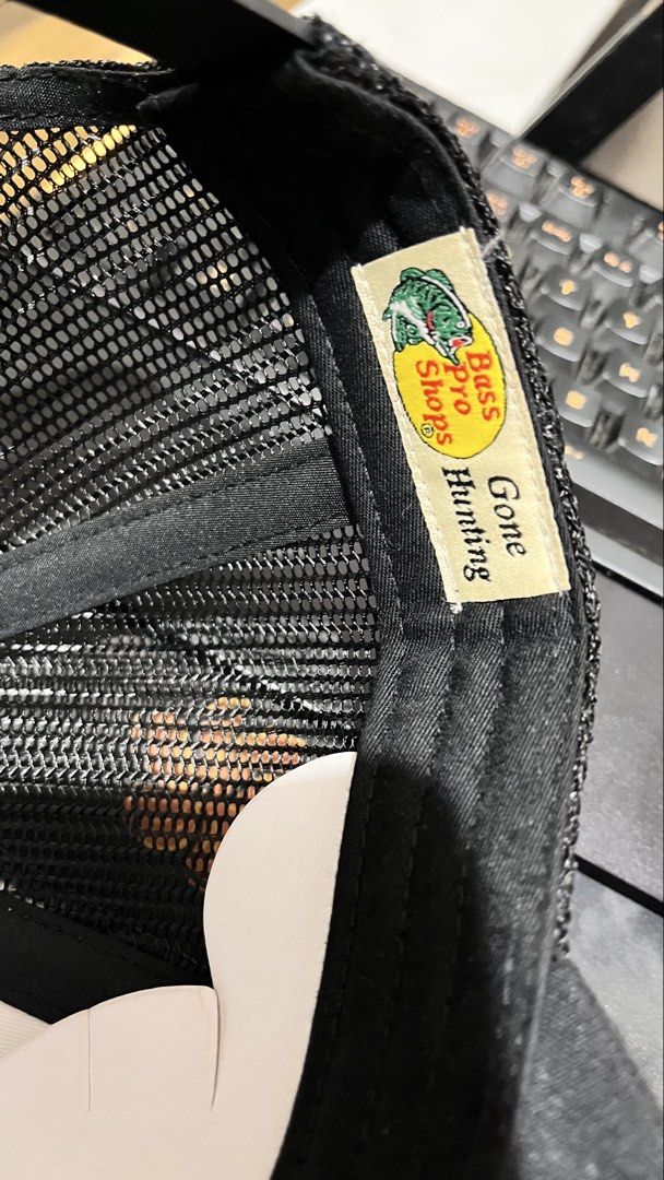 Bass Pro Shops Trucker Hat - Black (Category: Caps & Hats) located in Caloocan City. Submitted by memelpogi21 (Listing ID 1464529887, Image 3). Description: - Two Bass Pro Shops trucker hats included: one red/white, one black/white. - Features the iconic Bass Pro Shops logo with a fish design. - Breathable mesh back for comfort. - One size fits most design. - Ideal for fishing adventures or casual, stylish wear..