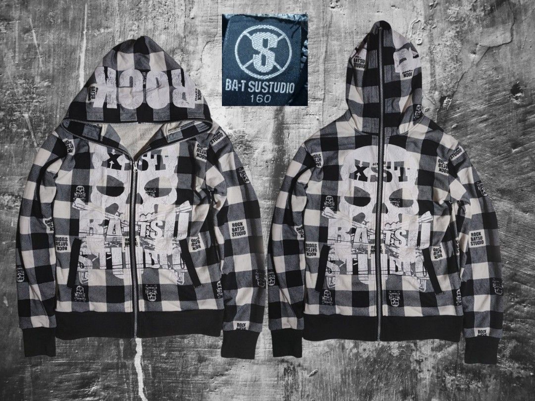 BA-Tsu Studio Full zip Skull Jacket (Category: Hoodies) located in Calabanga. Submitted by bekneegear (Listing ID 1464505271, Image 1). Description: - Brand: BATSU STUDIO - Style: Zip-up hoodie - Color/Pattern: Black and white plaid - Graphics: Large skull on front, text graphics on hood - Size: 160 - Details: Multiple cool details throughout.