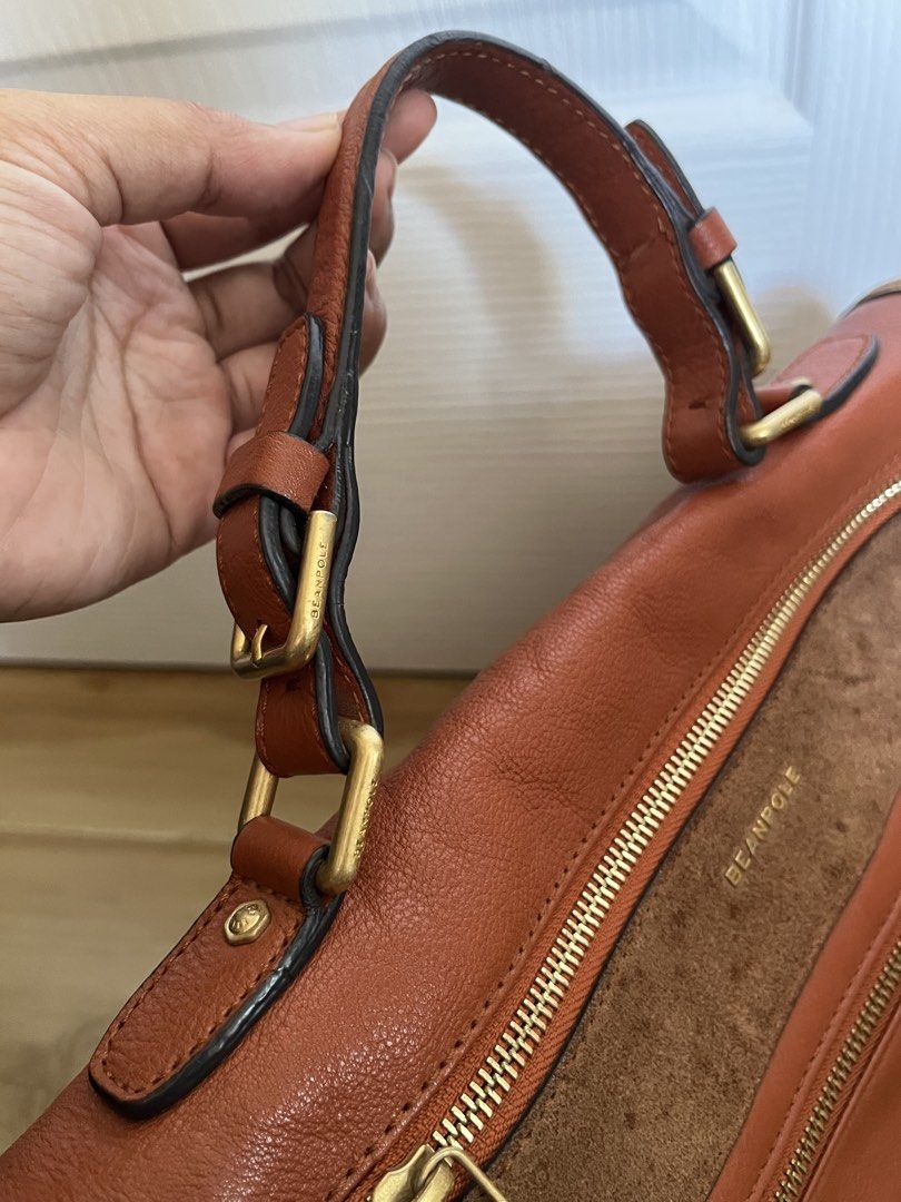 BEANPOLE Rust Satchel Bag (Category: Tote Bags) located in Sariaya. Submitted by retro.stuff (Listing ID 1464389682, Image 3). Description: BEANPOLE brown leather satchel bag with suede trim and gold hardware. Features top handles, detachable strap, and logo-lined interior with multiple pockets. Perfect for daily use. .
