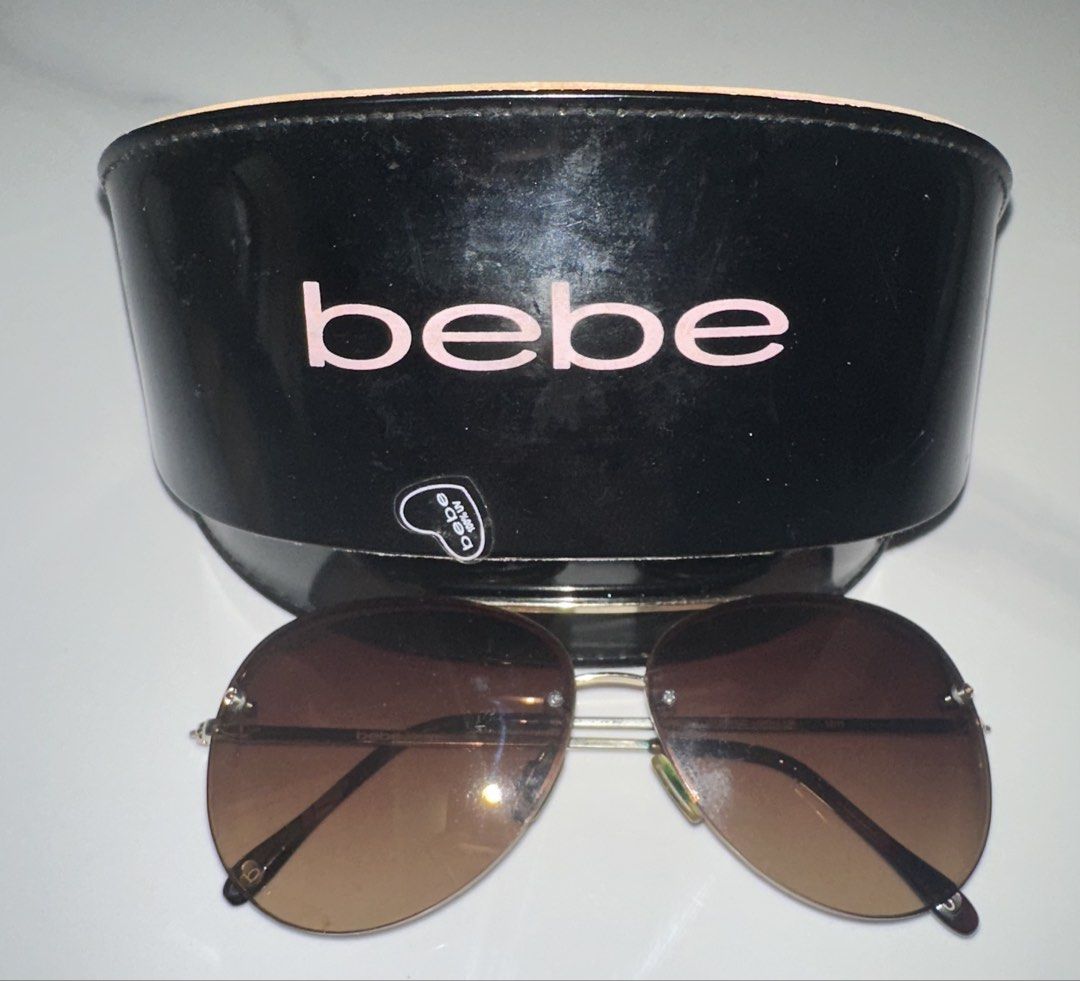 Bebe Aviator Sunglasses with Case and Cloth (Category: Sunglasses & Eyewear) located in Antipolo. Submitted by ririwearph (Listing ID 1464418851, Image 2). Description: - Authentic Bebe aviator sunglasses - Stylish brown gradient lenses - Comes with original Bebe hard case - Case features a cute 'i love Bebe' inscription inside - Includes a pink cleaning cloth with heart details - Ideal for sunny weather and outdoor activities - Don't miss out on