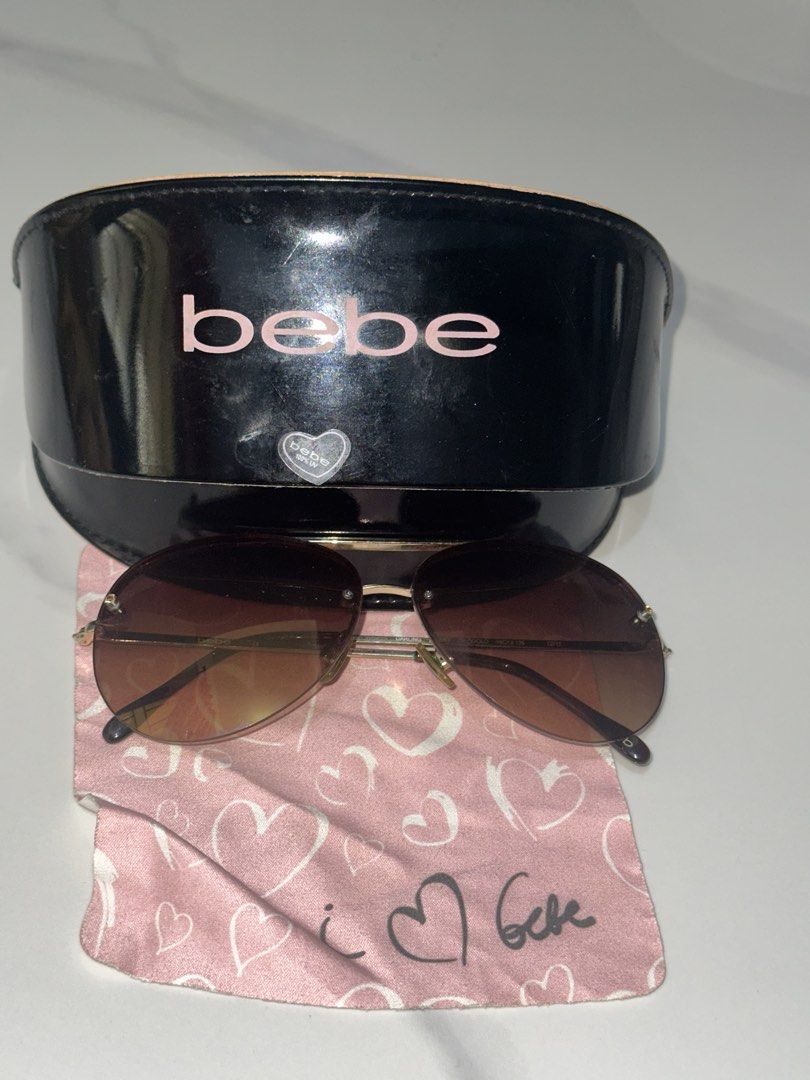 Bebe Aviator Sunglasses with Case and Cloth (Category: Sunglasses & Eyewear) located in Antipolo. Submitted by ririwearph (Listing ID 1464418851, Image 1). Description: - Authentic Bebe aviator sunglasses - Stylish brown gradient lenses - Comes with original Bebe hard case - Case features a cute 'i love Bebe' inscription inside - Includes a pink cleaning cloth with heart details - Ideal for sunny weather and outdoor activities - Don't miss out on