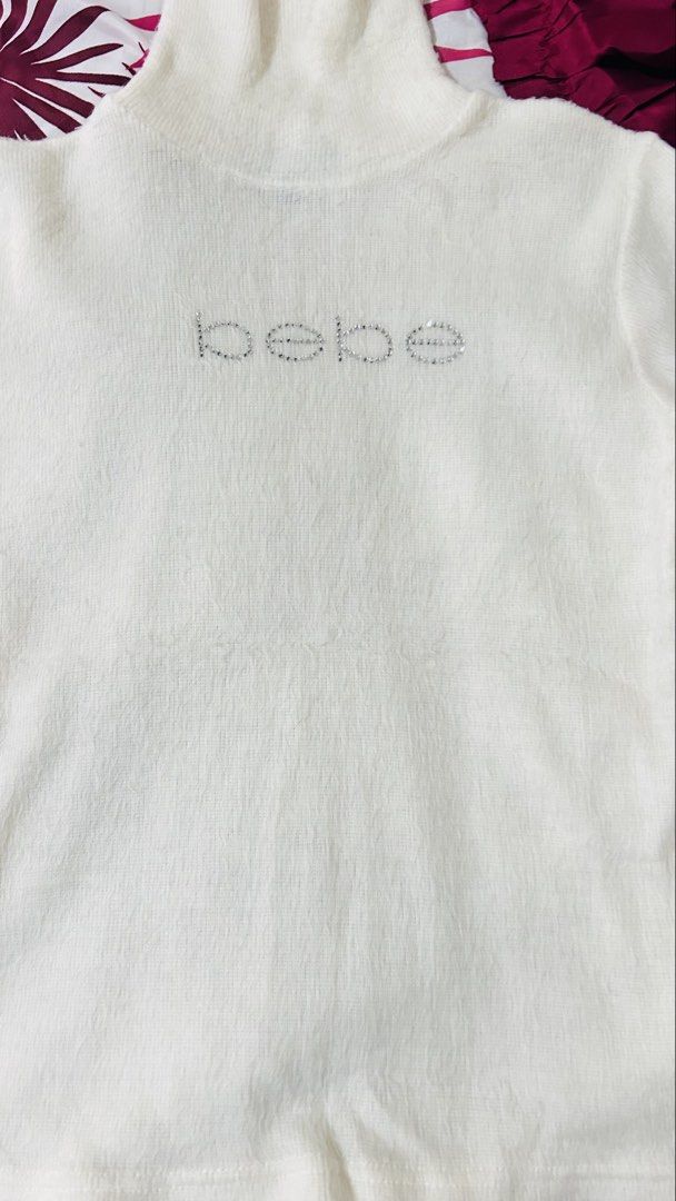 Bebe turtle neck top (Category: Shirts) located in Bauang. Submitted by alyssaaaamm (Listing ID 1464430976, Image 3). Description: Size s on tag stretch fabric Pa fur type .
