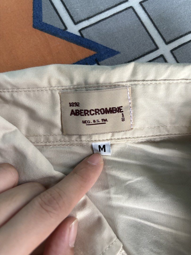 Beige Button-up Shirt (Category: Formal Shirts) located in Vigan. Submitted by prelovedbyr.1 (Listing ID 1464365823, Image 3). Description: personal preloved item color may vary due to lighting fits s-m condition: 10/10 loc: vigan city, I.S. mop: gcash/maribank mod: J&T.