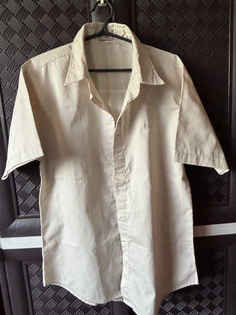 Beige Button-up Shirt (Category: Formal Shirts) located in Vigan. Submitted by prelovedbyr.1 (Listing ID 1464365823, Image 1). Description: personal preloved item color may vary due to lighting fits s-m condition: 10/10 loc: vigan city, I.S. mop: gcash/maribank mod: J&T.