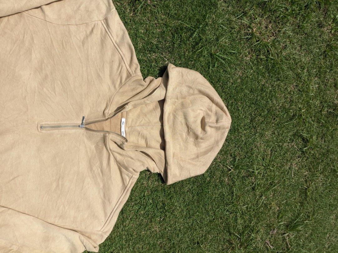 Beige Quarter Zip GU Hoodie (Category: Coats, Jackets and Outerwear) located in Alfonso. Submitted by swoosh4stripes (Listing ID 1464376577, Image 2). Description: - Comfortable beige hoodie with a quarter zip - Ribbed cuffs and hem - Soft fabric for ultimate comfort - Versatile for casual wear - Great for layering over other outfits - Easily pairs with jeans or joggers -halfzip GU 23w 23L.