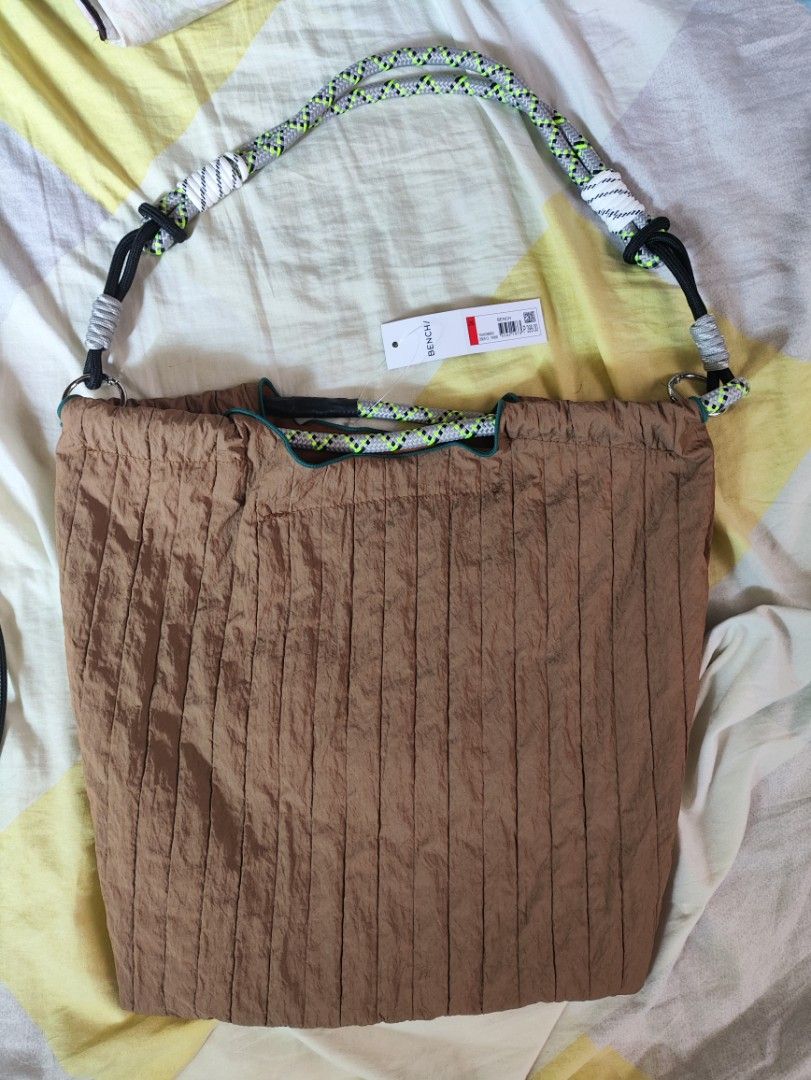 BENCH/ Brown Shoulder Bag (Category: Shoulder Bags) located in Manila. Submitted by warmshark.1ae1ea (Listing ID 1464395189, Image 1). Description: BENCH/ Brown Shoulder Bag – ₱350 Brand: BENCH/ Brand new, never used With original BENCH tag Original price: ₱399 Brown color Rope-style shoulder strap Lightweight casual bag.