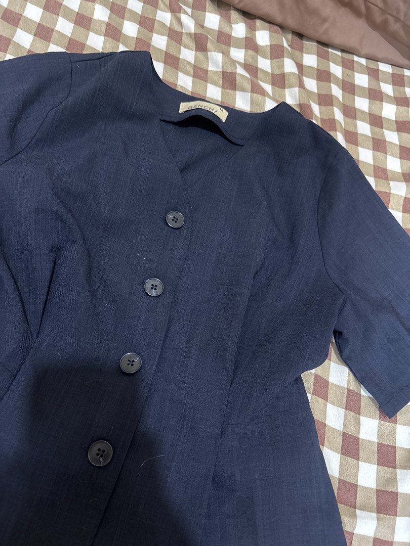 BENCH Navy Blue Button-Up Peplum Blouse (Category: Blouses) located in Imus. Submitted by kyla_declutters (Listing ID 1464381531, Image 2). Description: - Navy blue BENCH blouse - Short sleeves -worn once for a corporate headshot - V-neckline - Four front buttons - Peplum style with cinched waist - Perfect for corporate, or for casual elevated outfits.