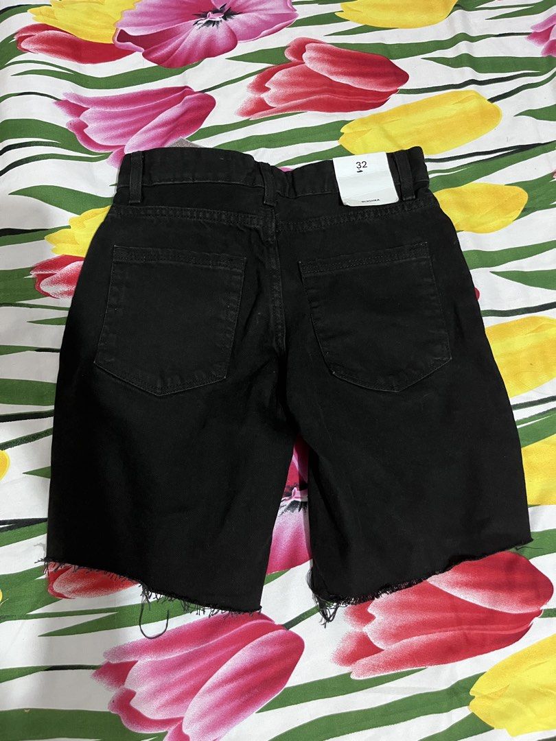 Bershka Black Denim Cut-Off Shorts Size 32 (Category: Shorts) located in Manila. Submitted by oddstorm_9d6c74 (Listing ID 1464456021, Image 2). Description: - Brand: Bershka - Color: Black - Material: Denim - Style: Classic five-pocket - Detail: Raw hem - Closure: Button and zip - Size: 32 - Occasion: Casual wear.