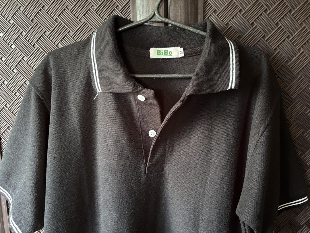 Bibo Black Polo Shirt (Category: Tshirts & Polo Shirts ) located in Vigan. Submitted by prelovedbyr.1 (Listing ID 1464362287, Image 2). Description: personal preloved item color may vary due to lighting Medium on tag condition: 8/10 flaw: slight himulmol loc: vigan city, I.S. mop: gcash/maribank mod: J&T.