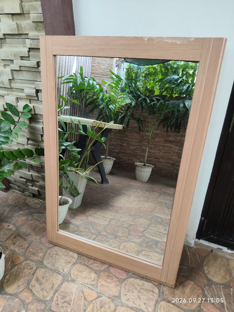 WALL MIRROR / VANITY MIRROR (Category: Mirrors) located in Rizal. Submitted by bestseller.ph (Listing ID 1464455795, Image 1). Description: Big rectangular shape mirror with a light wood-tone frame. Simple and classic design. The back is a plain brown board. Good for any room in the house. Easy to hang or lean against a wall. 🩷Type: Wall Mirror / Vanity Mirror 🩷Key Features: This large pre-loved wall mirror is perfect for adding depth, brightne