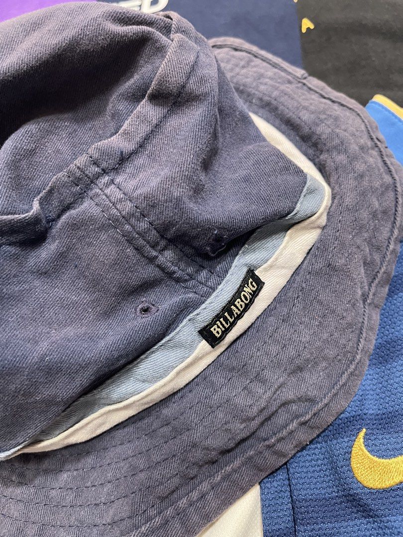 Billabong Bucket Hat with American Flag Patch (Category: Caps & Hats) located in Baao. Submitted by plainclothesdept (Listing ID 1464528190, Image 2). Description: Vintage 90s Billa/bong Bucket Hat dia - 7 in. faded, minimal discoloration 450 - Cool Billabong bucket hat - Dark blue color - Features embroidered American flag and eagle patch on the front - Billabong logo on the inside band - Ideal for sunny days out - Ready for a new owner.