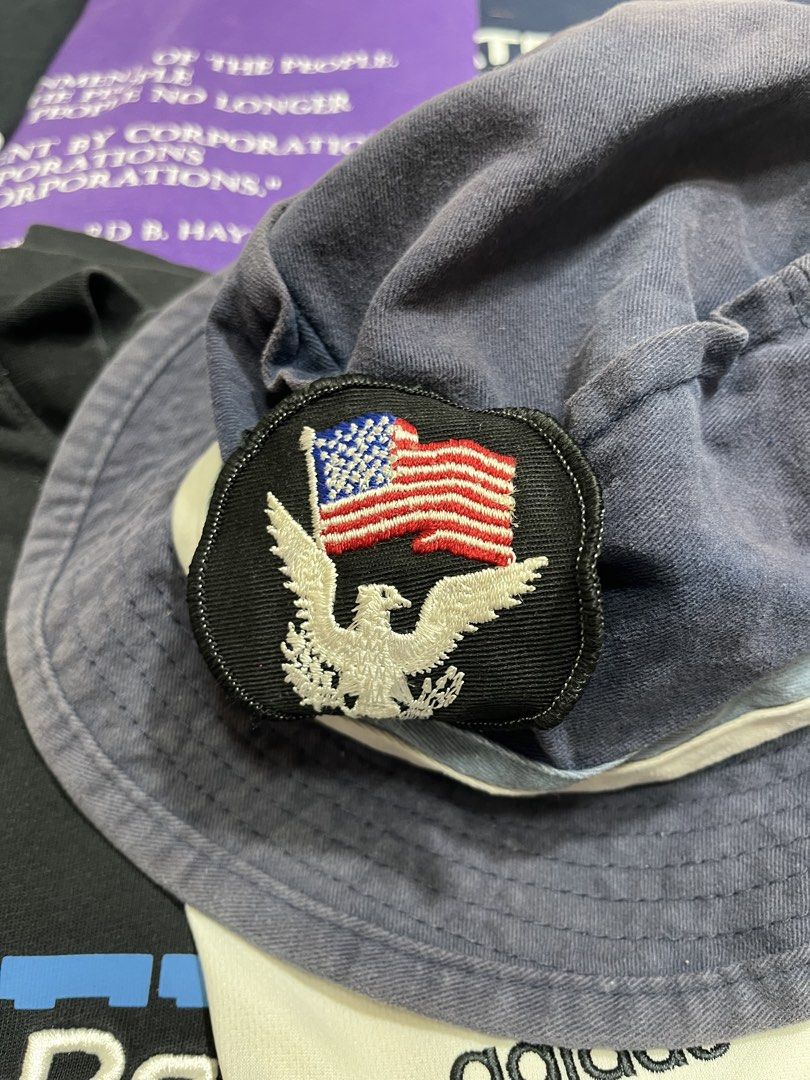 Billabong Bucket Hat with American Flag Patch (Category: Caps & Hats) located in Baao. Submitted by plainclothesdept (Listing ID 1464528190, Image 3). Description: Vintage 90s Billa/bong Bucket Hat dia - 7 in. faded, minimal discoloration 450 - Cool Billabong bucket hat - Dark blue color - Features embroidered American flag and eagle patch on the front - Billabong logo on the inside band - Ideal for sunny days out - Ready for a new owner.