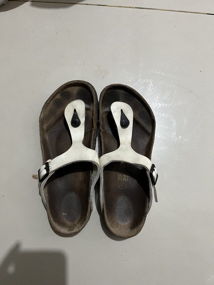 Birkenstock Gizeh White Patent Sandals (Category: Flats & Sandals) located in Imus. Submitted by louiemarie (Listing ID 1464545547, Image 1). Description: - Birkenstock Gizeh sandals - Color: White - Material: Leather straps with adjustable buckle - Footbed: Cork - Style: Comfortable and classic.