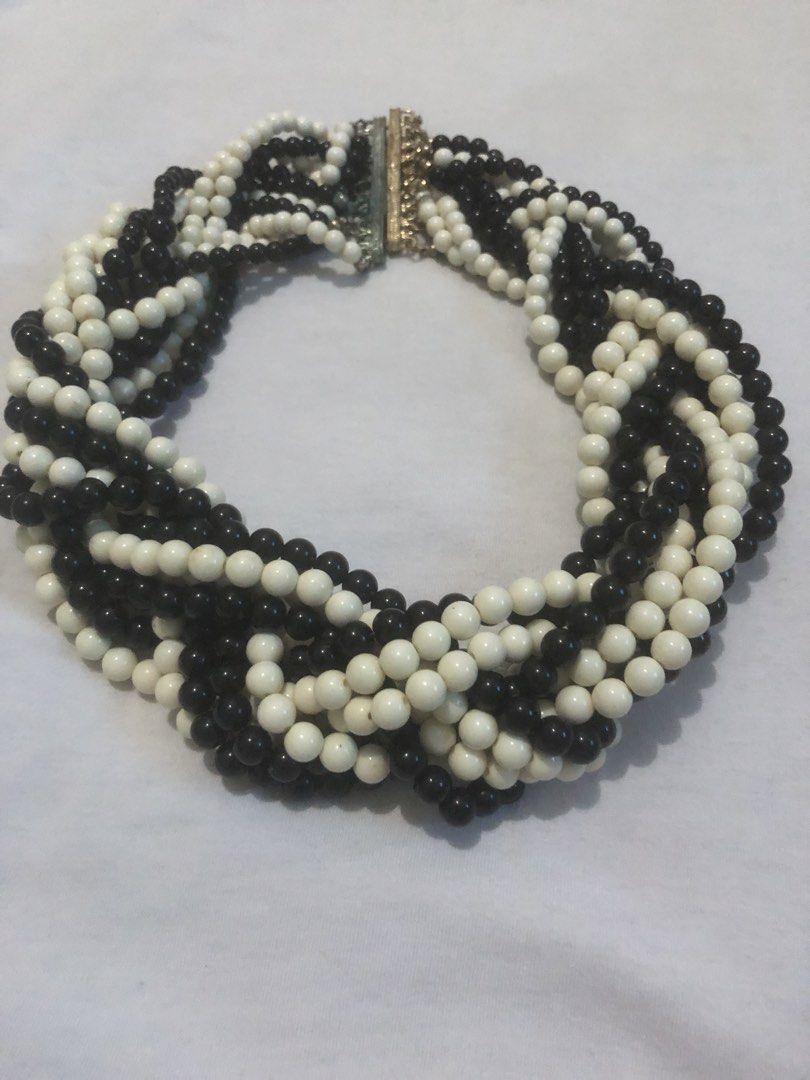 Black and White Beaded Twisted Necklace (Category: Necklaces) located in Quezon City. Submitted by unique2shop (Listing ID 1464476665, Image 1). Description: - Chunky twisted necklace - Black and white beads - Multiple strands woven together - Metal clasp closure - Unique statement pieces - Perfect for dressing up any outfit - Very elegant looking piece of jewelry , very flattering when worn with black outfit Can be worn both in formal and semi f