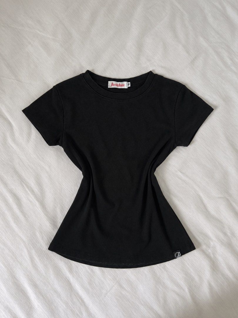 Black Basic Tee (Category: Shirts) located in Singapore. Submitted by astelling (Listing ID 1464419202, Image 1). Description: - Color: Black - Style: Basic T-shirt - Neckline: Crew neck - Sleeves: Short sleeves - Features: Small logo detail on hem - Occasion: Everyday wear.