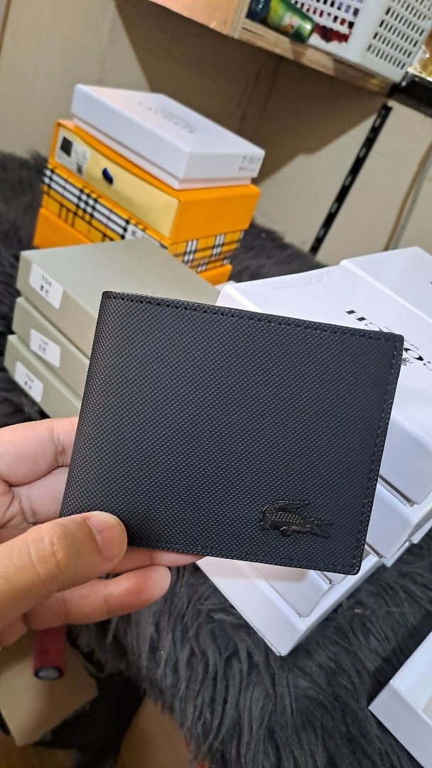Black Crocodile Logo Bifold Wallet (Category: Wallets & Card Holders) located in Manila. Submitted by johnbooc.04 (Listing ID 1464496168, Image 1). Description: - Sleek black bifold wallet - Textured finish for a premium feel - Elegant black crocodile logo on the front - Comes with its original box, perfect for gifting - Multiple card slots and compartments for organized storage - Ideal for everyday use and essential organization.