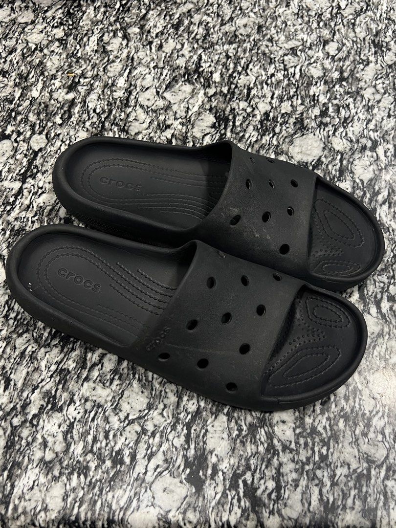 Black Crocs Slides classic. authentic (Category: Slippers & Slides) located in Calasiao. Submitted by pb.supply_v2 (Listing ID 1464547523, Image 1). Description: - Classic black Crocs slides - Easy slip-on and off design - Perfect for casual outings or post-sports relaxation - Shows minor scuffs from normal wear - Plenty of life remaining, great value!.