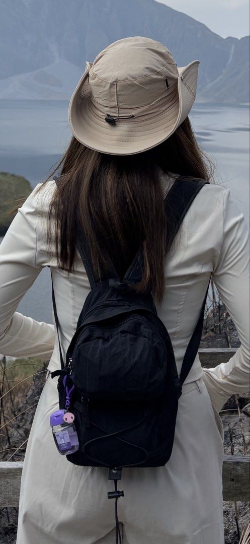 Black Hiking Mini Backpack and Beige Bucket Hat Set (Category: Backpacks) located in Caloocan City. Submitted by ashpreloves (Listing ID 1464395905, Image 3). Description: - Used once only both in good condition - Black mini backpack with multiple zippered pockets - Adjustable straps for comfort - Beige bucket hat with secure drawstring - Ideal for outdoor adventures and everyday wear.
