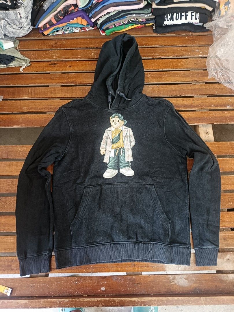 Black Hoodie with Bear Graphic (Category: Coats, Jackets and Outerwear) located in Calamba. Submitted by sulitshopaholic (Listing ID 1464357302, Image 1). Description: - Stylish black hoodie featuring a cool bear graphic on the front. - Equipped with a convenient front pocket for your essentials. - Adjustable hood with drawstrings for a customized fit. - Approximate measurements: 18 inches (pit to pit) and 25 inches (length). - Ideal for casual o