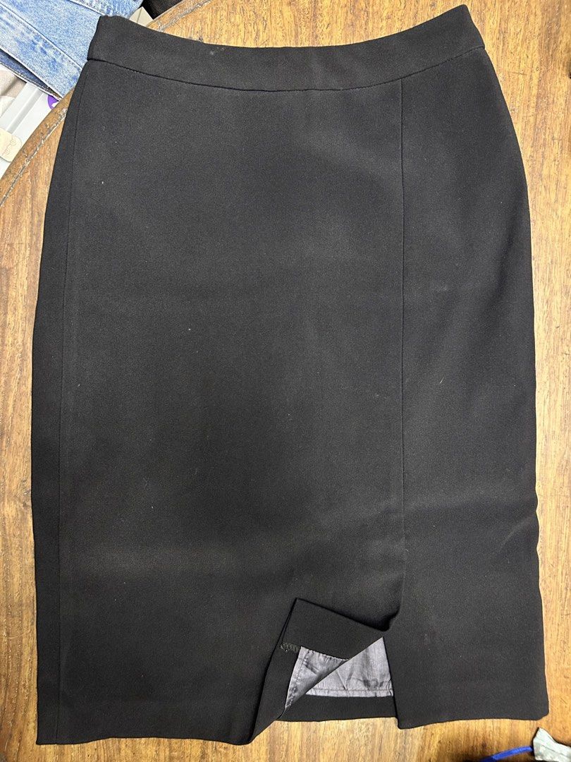 Black Office Skirt (Category: Skirts) located in Manila. Submitted by tshopph (Listing ID 1464401577, Image 2). Description: Black High-Waist Pencil Skirt with Front Slit A sleek, structured, and sophisticated black pencil skirt featuring a subtle front slit and clean panel detailing! Fully lined for comfort and finished with a back zip closure, making it perfect for office wear, formal events, or smart-casual outfits 🖤 ✨ Style: High-waisted mid