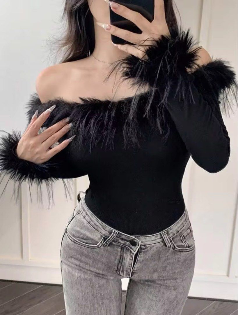 Black Off-Shoulder Feather Trim Long Sleeve Top (Category: Longsleeves) located in Quezon City. Submitted by jjaamm (Listing ID 1464519441, Image 1). Description: Never worn. Thin material. Orig price: 350 - Black off-shoulder top - Long sleeves - Fluffy feather trim on neckline and cuffs - Body-hugging fit - Ideal for night outs or parties - Versatile: pair with jeans or a skirt - Super chic and trendy.