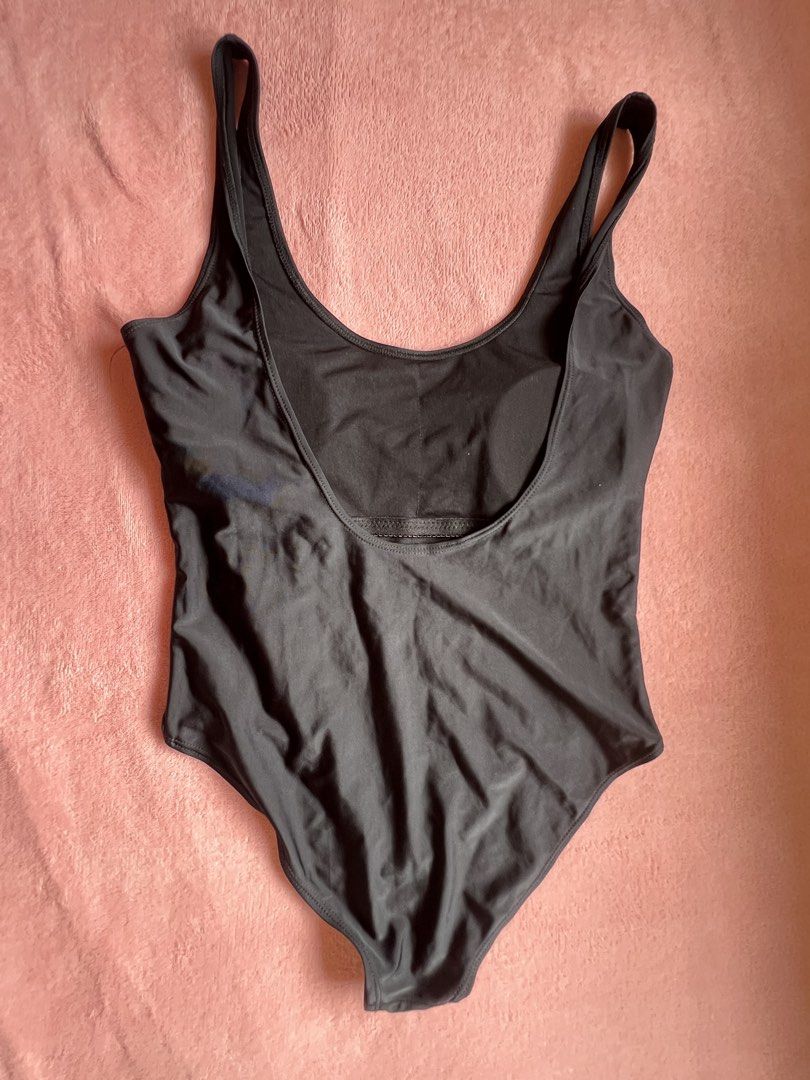 Black One-Piece Swimsuit (Category: Bikinis & Swimsuits) located in Batangas. Submitted by alaisaampa7513 (Listing ID 1464570004, Image 2). Description: - Classic black one-piece swimsuit - Flattering scoop neckline - Low scoop back design - Comfortable and versatile fit - Ideal for swimming or lounging by the pool.