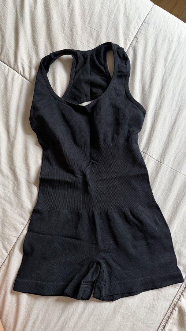 Black Ribbed One-Piece Workout Bodysuit (Category: Bikinis & Swimsuits) located in Makati City. Submitted by nisayaptinchay (Listing ID 1464366805, Image 1). Description: Black ribbed bodysuit with a racerback design. Has a cutout detail at the back. The material is stretchy and seamless. Great for workouts or layering. Shorts bottom..