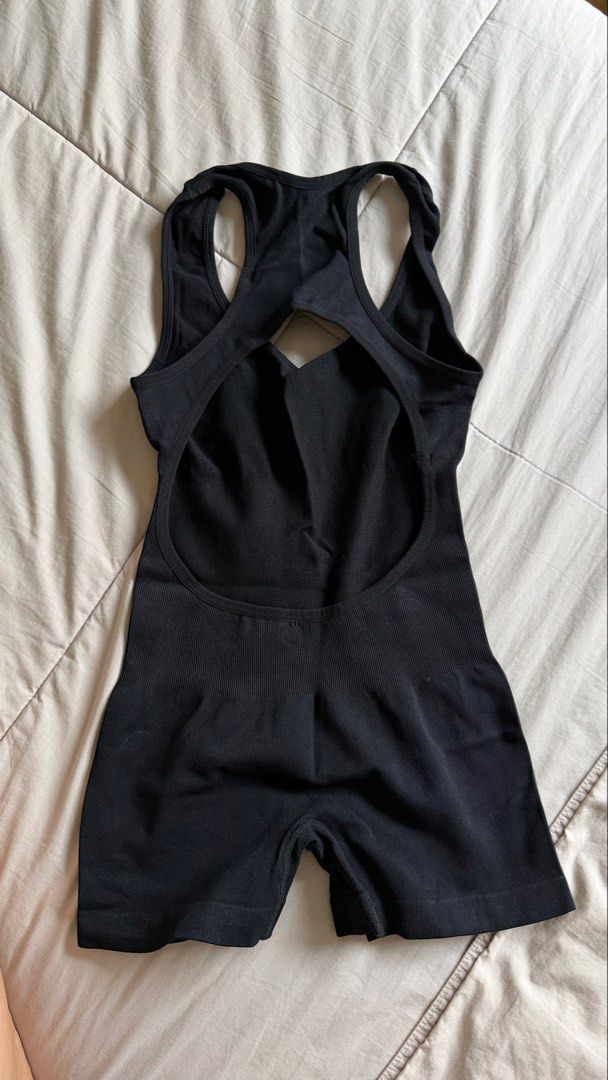Black Ribbed One-Piece Workout Bodysuit (Category: Bikinis & Swimsuits) located in Makati City. Submitted by nisayaptinchay (Listing ID 1464366805, Image 2). Description: Black ribbed bodysuit with a racerback design. Has a cutout detail at the back. The material is stretchy and seamless. Great for workouts or layering. Shorts bottom..