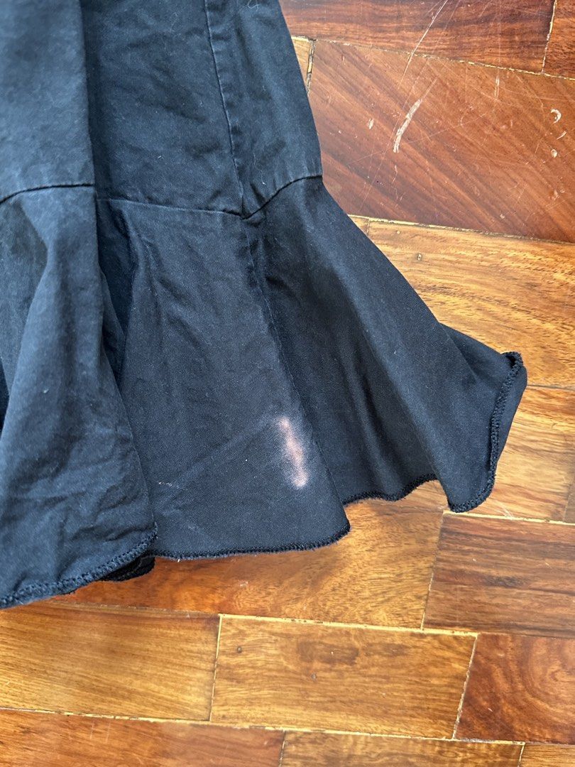 Black Ruffle Hem Skirt Size S (Category: Skirts) located in Cainta. Submitted by buy.preloved (Listing ID 1464375612, Image 2). Description: - Black skirt with a stylish ruffled hem - Zipper closure at the back - Size S (check measurements if needed) - Please note: small stain on one of the ruffles (see 2nd photo).