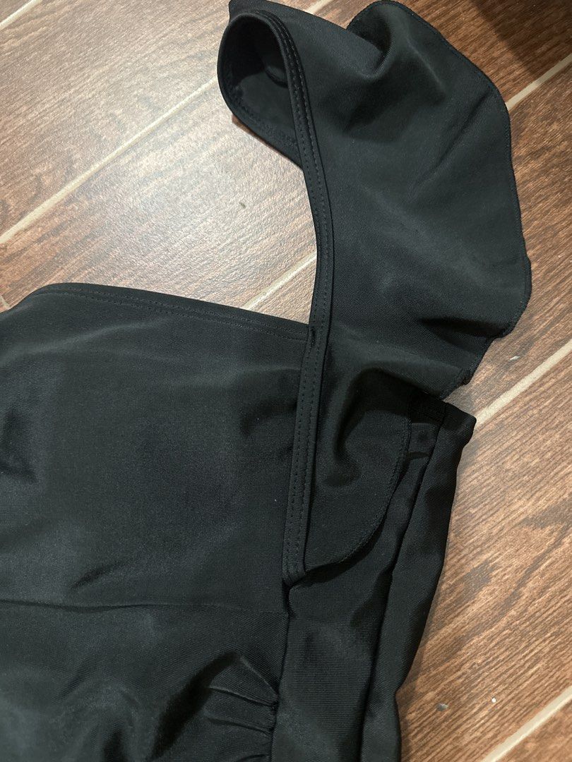 Black Ruffle Strap Ruched One-Piece Swimsuit (Category: Bikinis & Swimsuits) located in Marikina City. Submitted by rctoby00 (Listing ID 1464440861, Image 3). Description: - Chic black one-piece swimsuit - Flattering ruffle straps - Adjustable ruched sides for a perfect fit - Elegant square neckline - Secure and adjustable back ties - Ideal for beach and pool outings - Comfortable and stylish design.