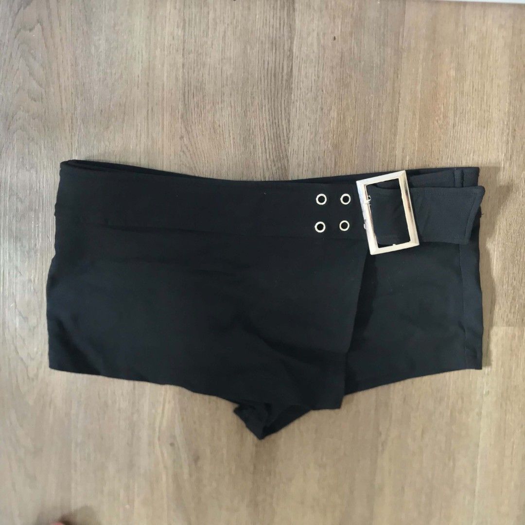 Black shorts with buckle and eyelets (Category: Shorts) located in Manila. Submitted by joshbelgic17602 (Listing ID 1464436253, Image 1). Description: - Stylish black shorts - Features a silver buckle detail - Four eyelets on the waistband - Wrap-around style design - Ideal for night outs or festival outfits - Comfortable and fashionable.