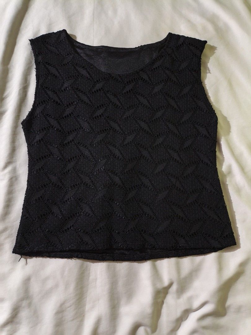 Black Sleeveless Textured Knit Top (Category: Sleeveless) located in Manila. Submitted by ms_pamaqued (Listing ID 1464355048, Image 1). Description: - Black sleeveless top - Unique textured knit pattern - Fabric with a slight sheen - Rounded neckline - Raw edges on sleeves and hem - Ideal for layering or wearing solo - Easy to pair with any outfit.