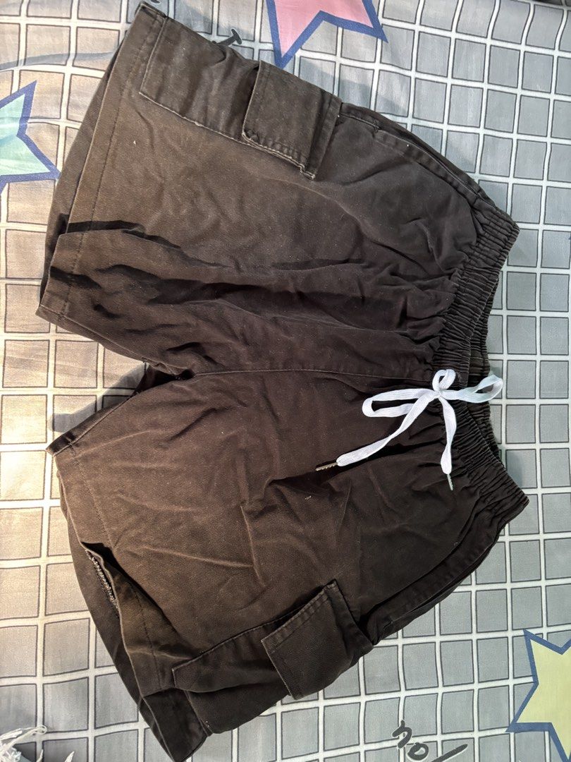 Black Stretchable Cargo Shorts (Category: Shorts) located in Vigan. Submitted by prelovedbyr.1 (Listing ID 1464362597, Image 1). Description: personal preloved item color may vary due to lighting fits s-m condition: 9/10 flaw: has black stain at the back loc: vigan city, I.S. mop: gcash/maribank mod: J&T.