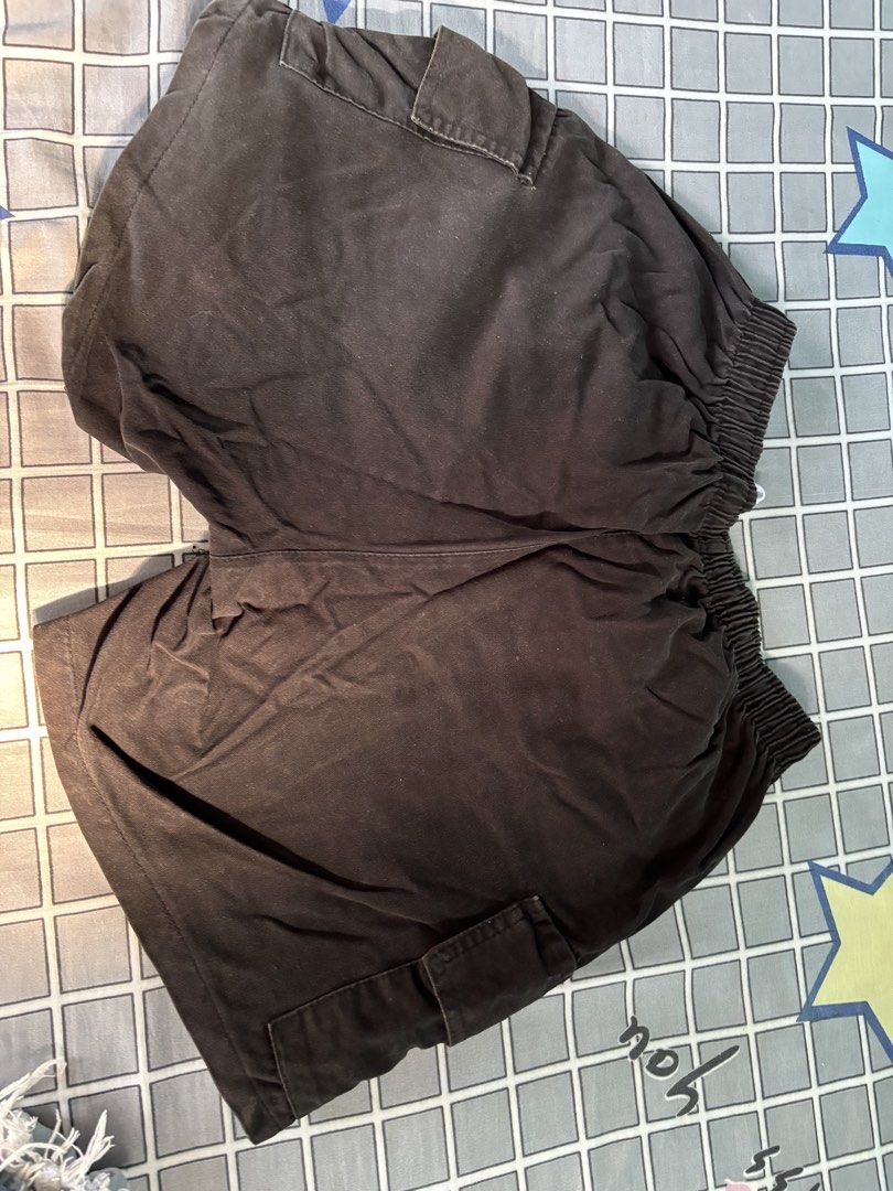 Black Stretchable Cargo Shorts (Category: Shorts) located in Vigan. Submitted by prelovedbyr.1 (Listing ID 1464362597, Image 2). Description: personal preloved item color may vary due to lighting fits s-m condition: 9/10 flaw: has black stain at the back loc: vigan city, I.S. mop: gcash/maribank mod: J&T.