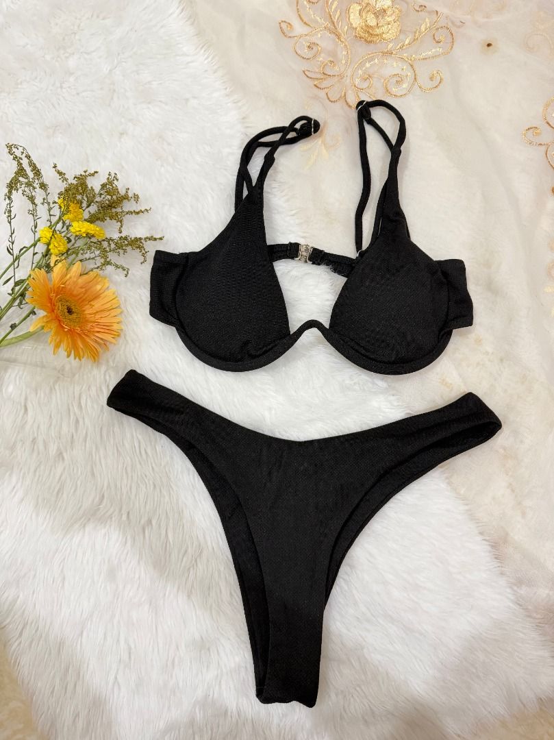 Black Underwire Two Piece Swimsuit (Category: Bikinis & Swimsuits) located in Mandaluyong City. Submitted by prelovedbyrinoa_ (Listing ID 1464357834, Image 1). Description: Cute and versatile swimsuit, perfect for beach days, pool trips, and vacations! 🌴✨ • Padded cups • Underwire support • Stylish & comfy fit • Preloved / • Good condition.